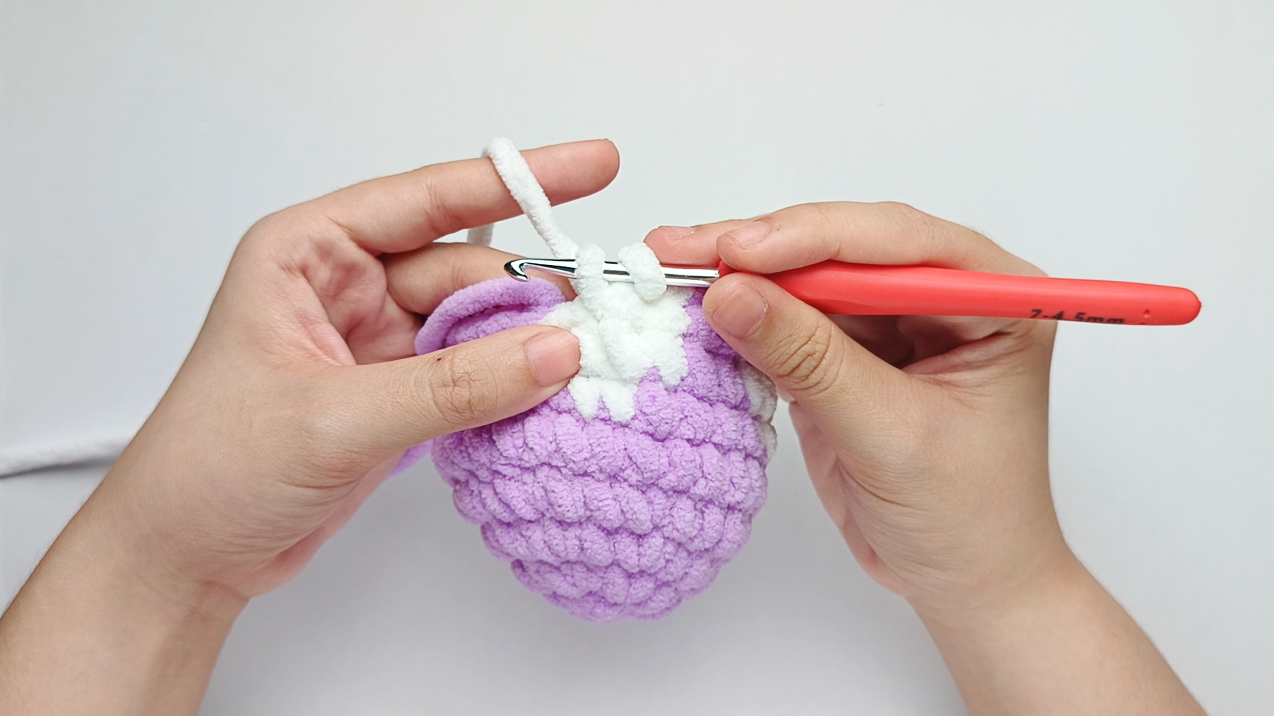 Make 3 white single crochets (sc): Color change to white, make 3 white single crochets (sc), and stop just before the final yarn over.