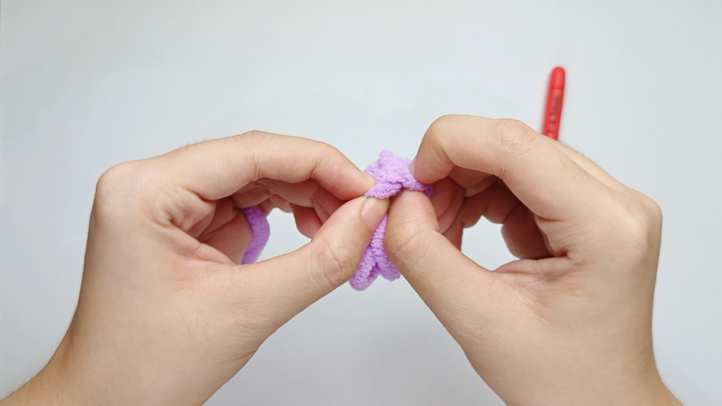 Push the wrong side inward: Push the wrong side inward so the right side faces outward.