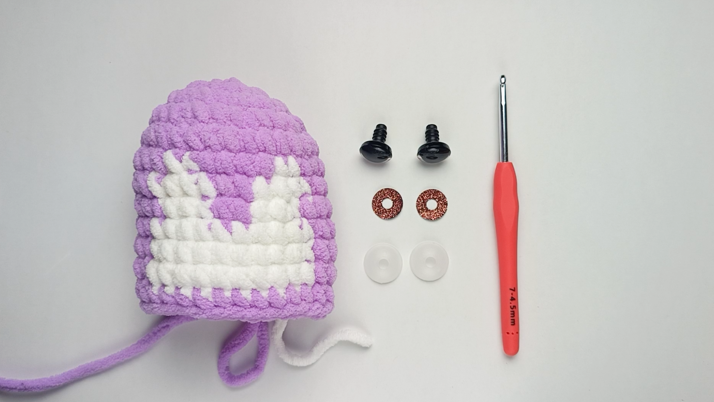 The three parts:   Each safety eye has three parts: the eye, with a stem on the back, the colored fabric disc that sits behind it, and the backing washer that locks onto it.