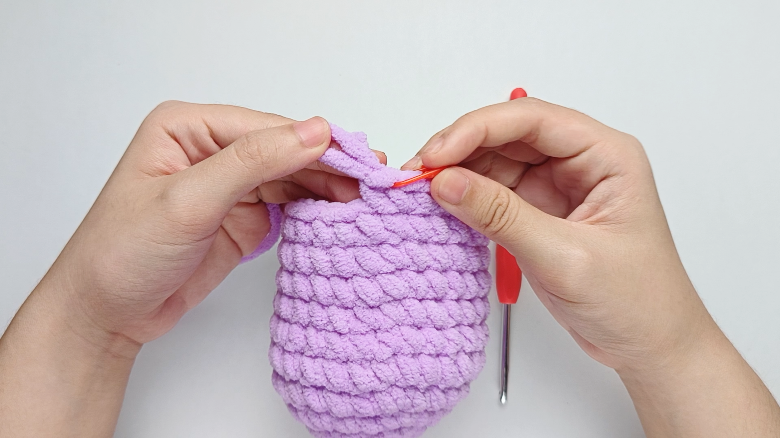 Mark the first stitch: Remove your hook for a moment, and use the stitch marker to mark this first stitch.