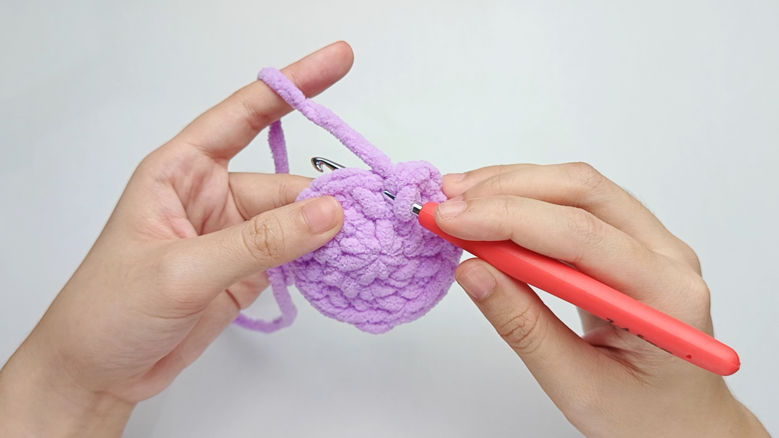 Hook back in: Insert your hook into that marked stitch to begin Round 4. Remove the stitch marker so the stitch is easier to work into.