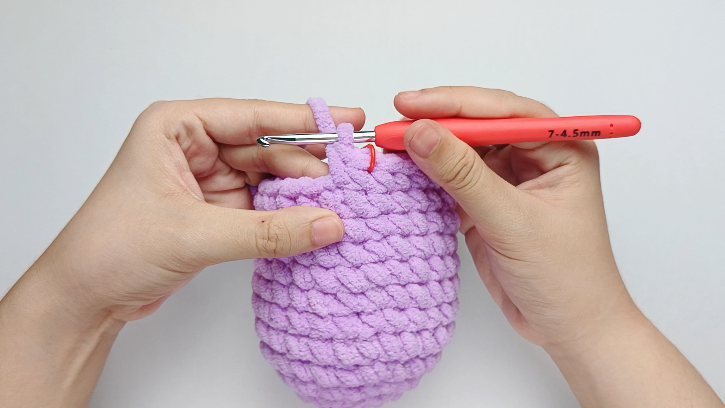 Make the second single crochet (sc): Yarn over, pull through, yarn over again, and pull through both loops.