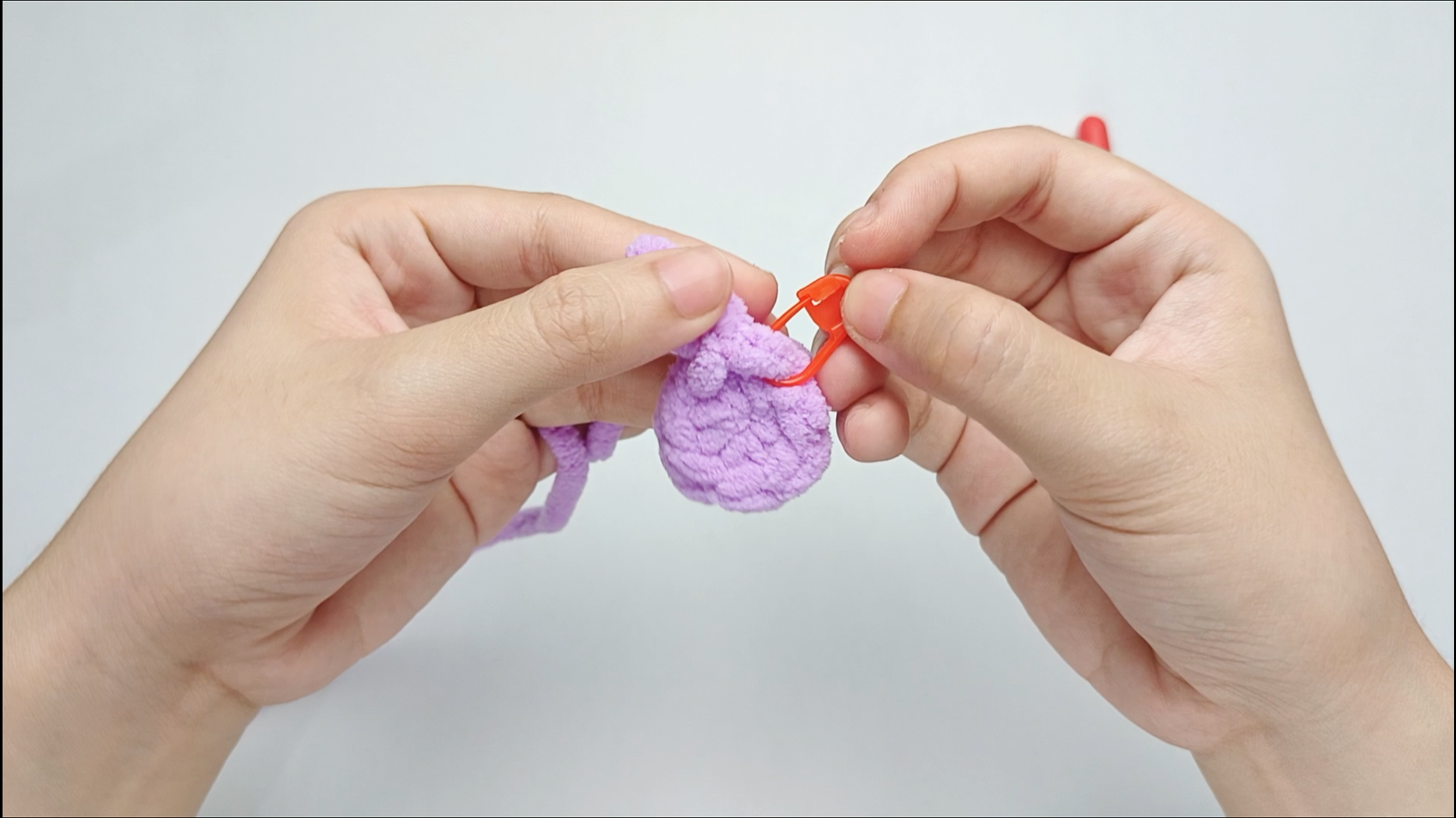 Mark the first stitch: Remove your hook for a moment, and use the stitch marker to mark this first stitch.