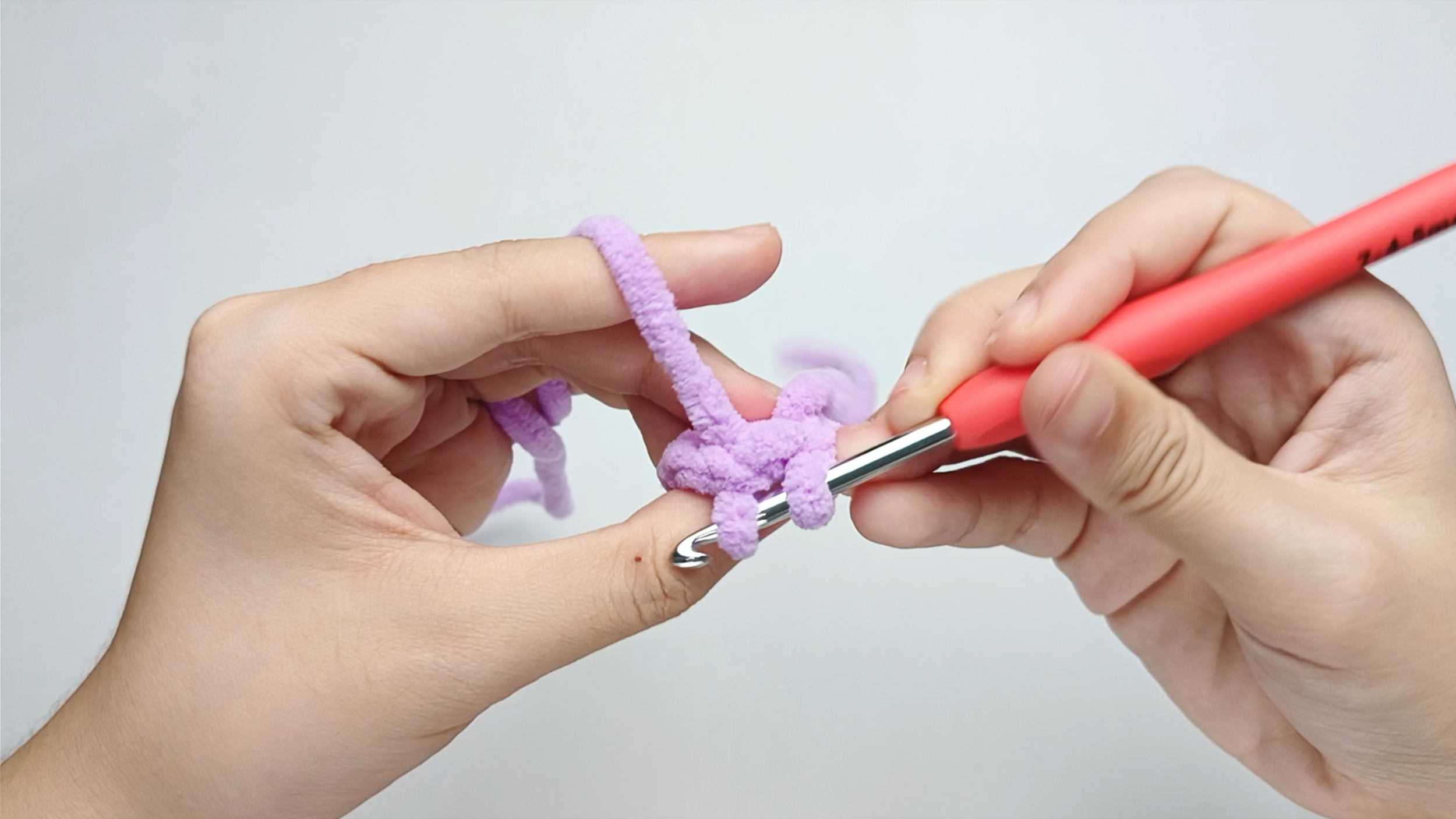 Pull through: Pull the yarn through the stitch. You should now have two loops on your hook.