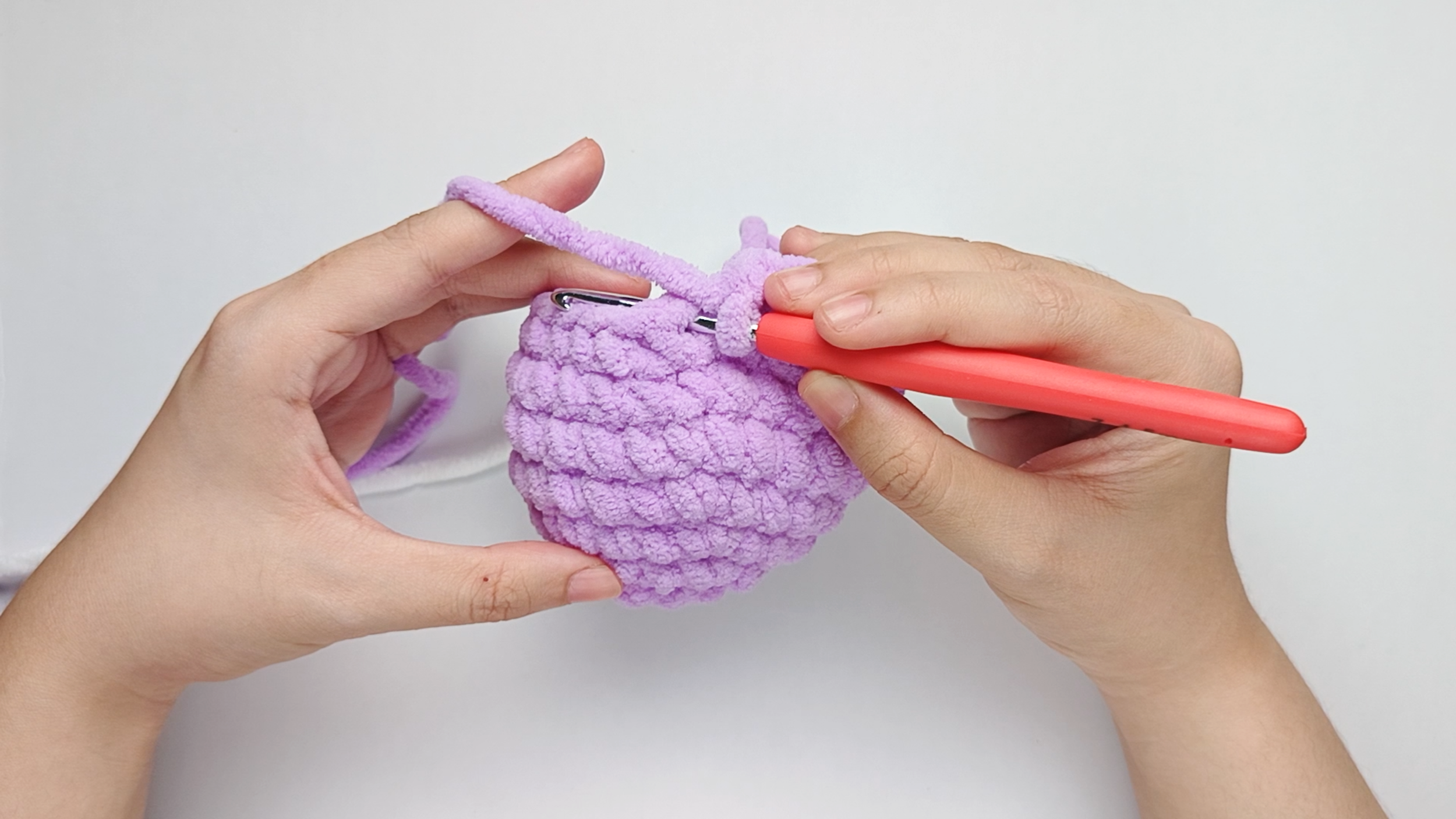 Hook back in: Insert your hook into that marked stitch to begin the round. Remove the stitch marker so the stitch is easier to work into.
