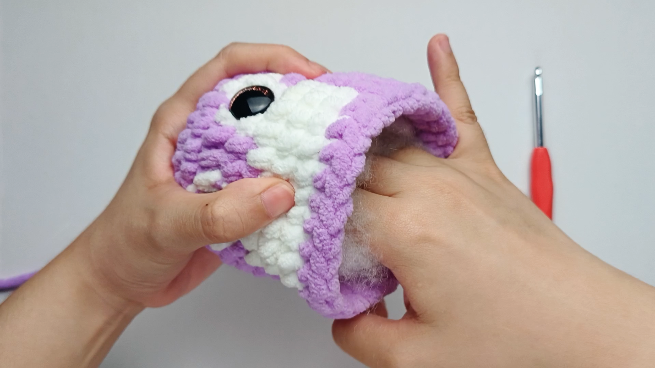 Stuff the Body: Add small amounts of stuffing at a time and gently shape the Body as you go. Add enough stuffing for the Body to feel firm, soft, and rounded.