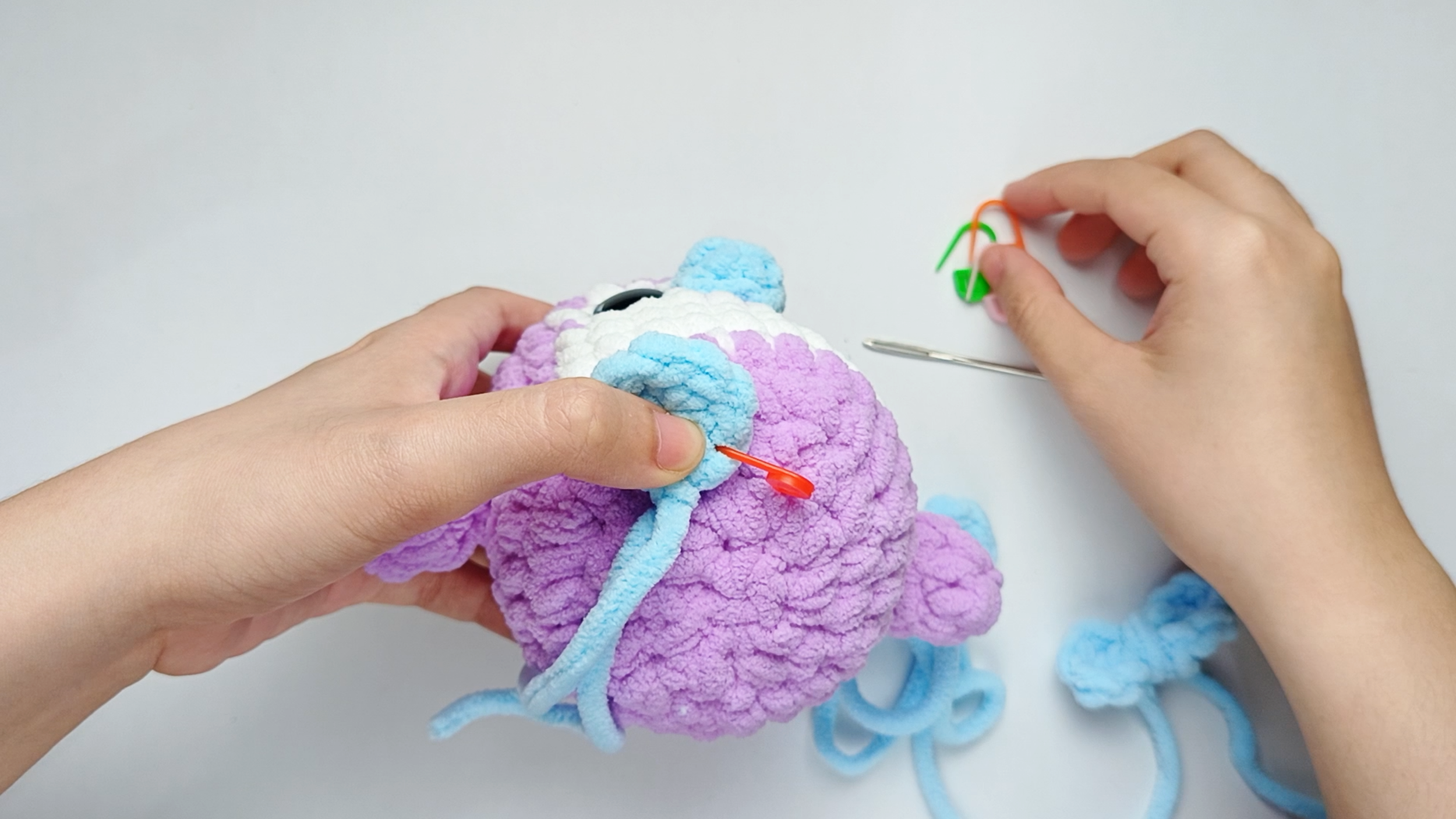 Position and secure the first Foot: Position the first Foot underneath the Body, leaving about 2 stitches of space between the Feet so they look balanced.