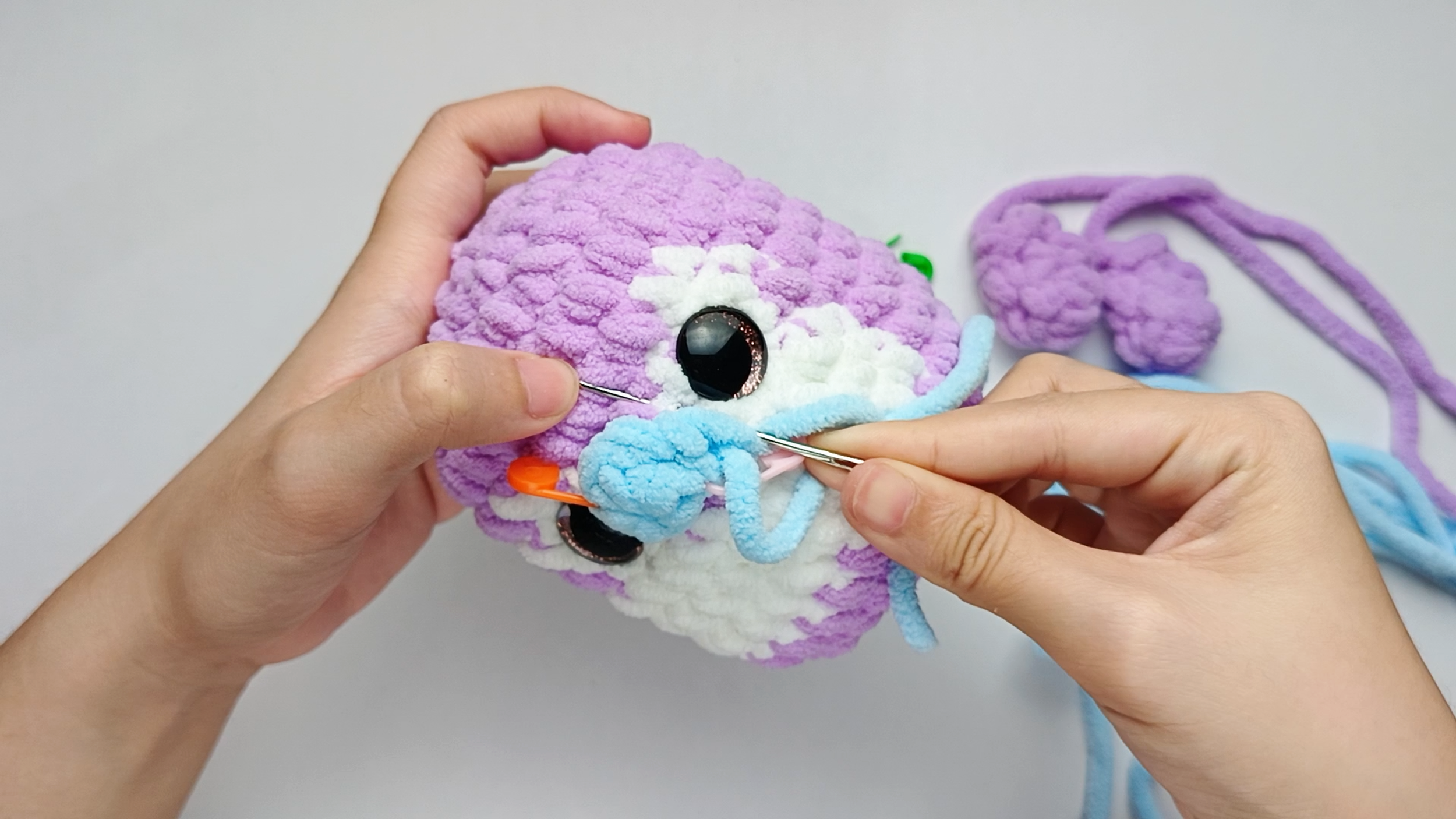 Into the Body: Insert the needle into one stitch of the Body, lining it up with the next stitch on the piece. Pull the yarn all the way through.