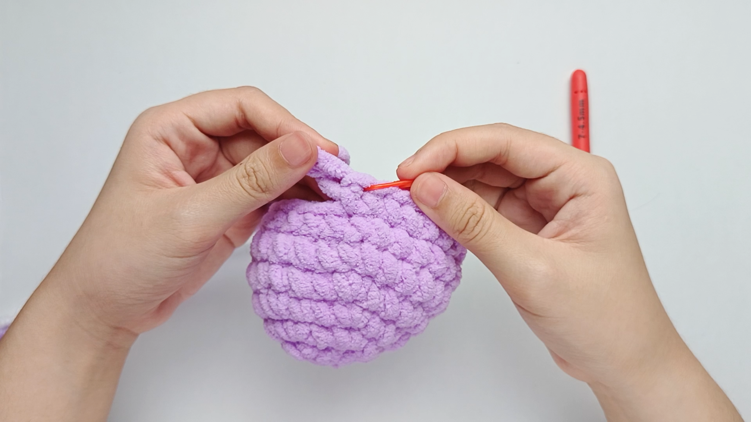 Mark the first stitch: Remove your hook for a moment, and use the stitch marker to mark this first stitch.
