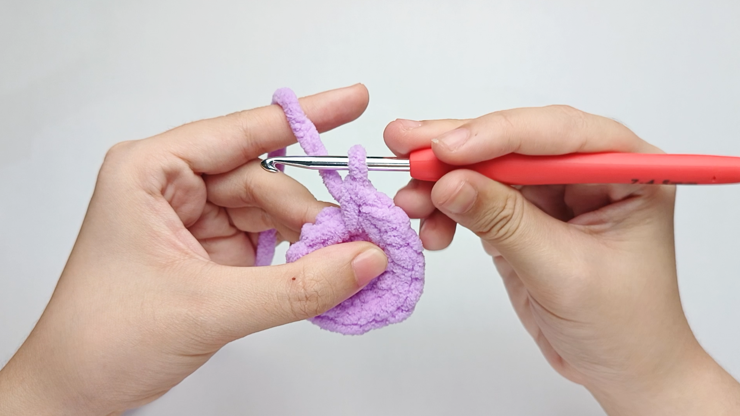 Make 1 single crochet (sc) first: Yarn over, pull through, yarn over again, and pull through both loops.