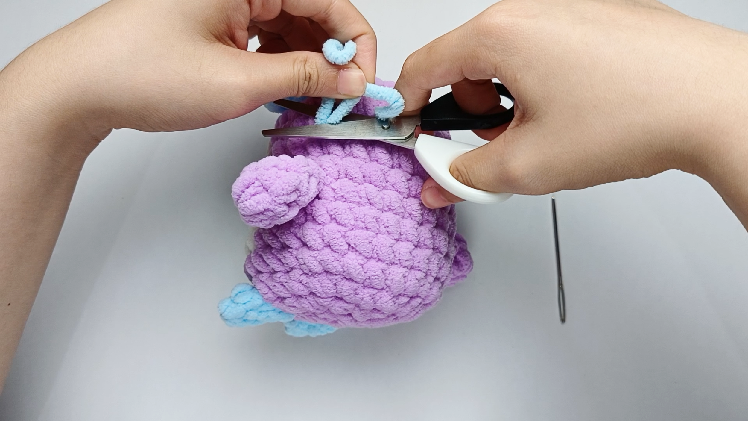 Trim the tails: Trim the tails close to the surface and gently massage the area so the end disappears inside.