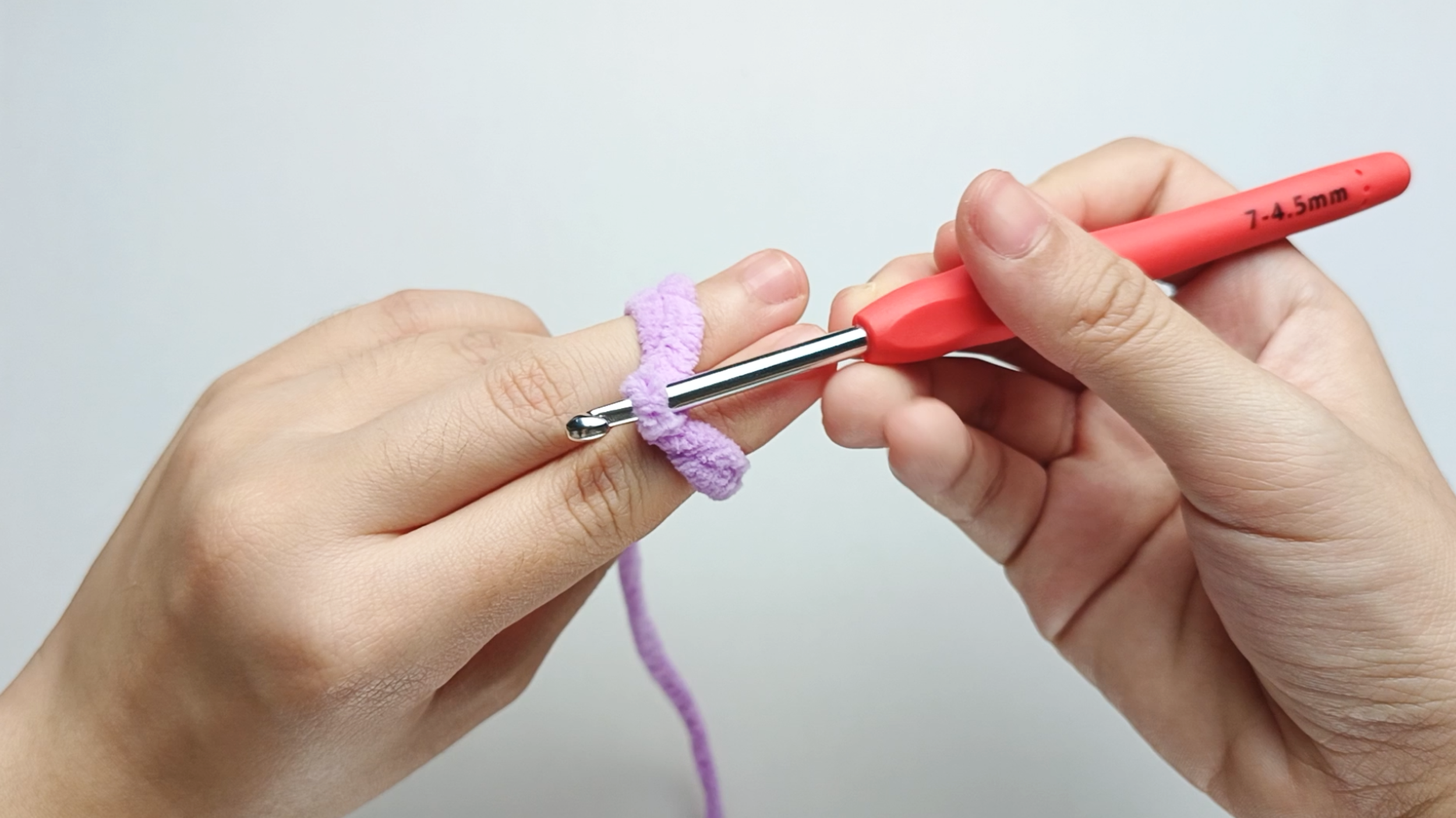 Twist the hook: Twist the hook to form a loop. The hook tip should be facing you.