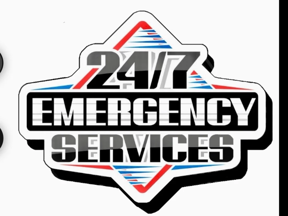 A logo for 24/7 emergency services with a shield design, featuring red, blue, gray, black, and white colors.