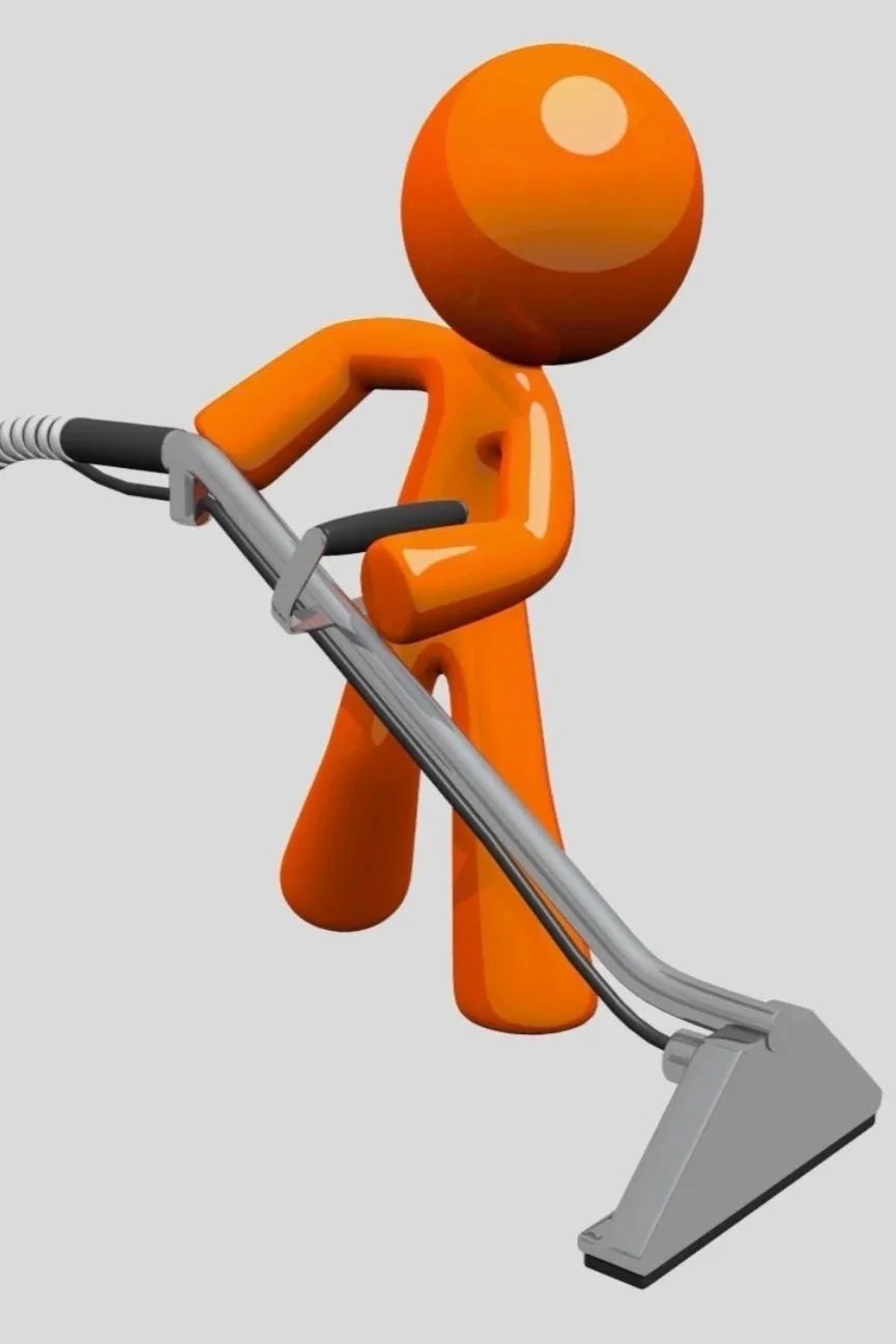 A cartoon orange figure cleaning with a vacuum cleaner.
