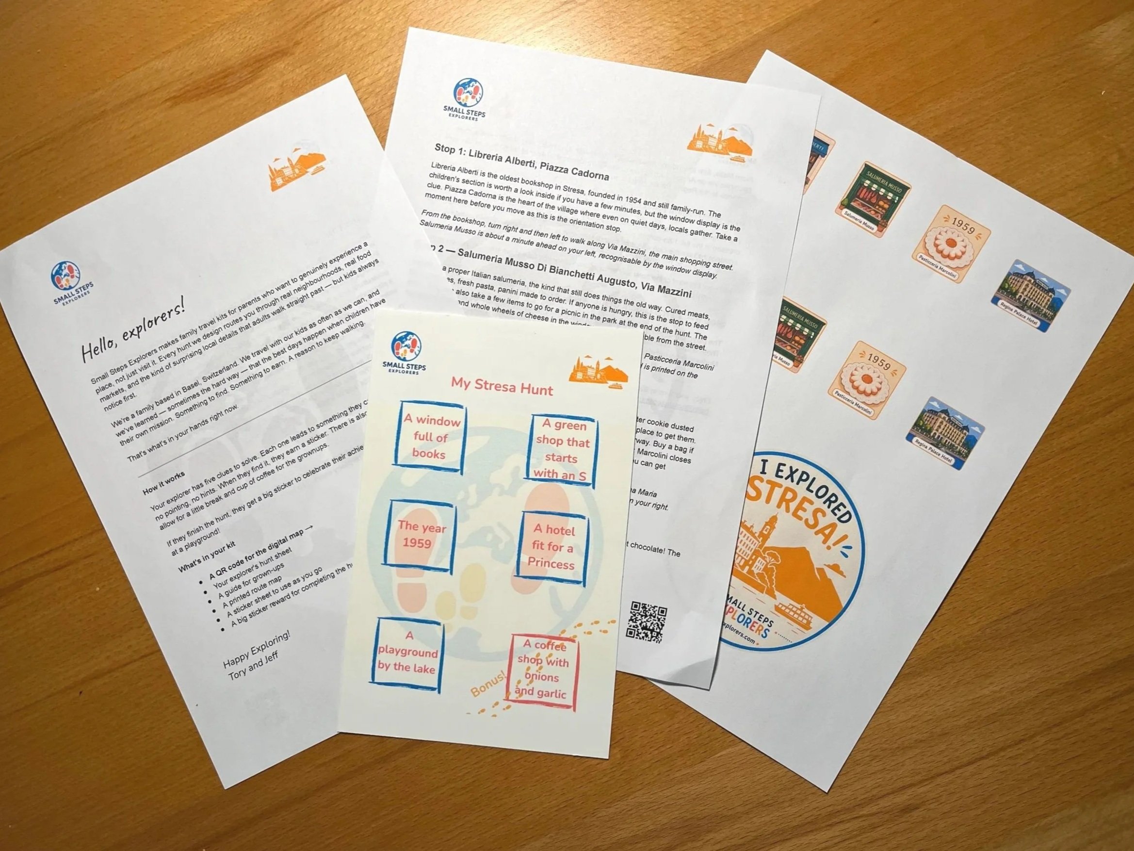Stresa scavenger hunt kit laid out flat — hunt sheet, sticker sheet, grown-ups guide and explorer badge — Small Steps Explorers