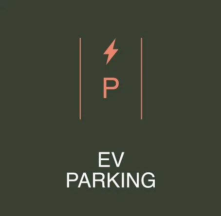 EV parking sign with a lightning bolt symbol and a 'P' in the center, on a dark green background.
