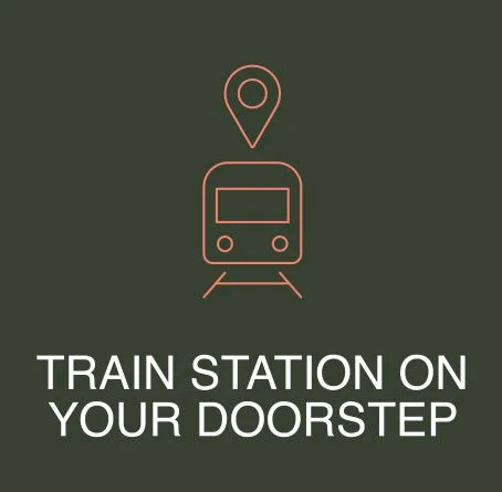 Illustration of a train and location marker with text "Train station on your doorstep" on a dark background.