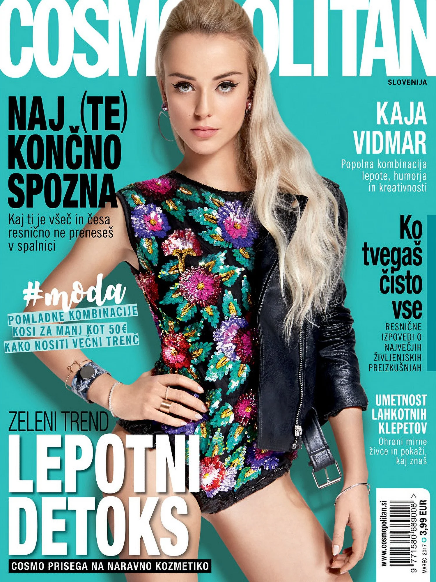 Cover of Cosmopolitan magazine featuring a young woman with long blonde hair, wearing a colorful floral top and a black leather jacket, with various headlines in Slovenian about beauty, fashion, and lifestyle.
