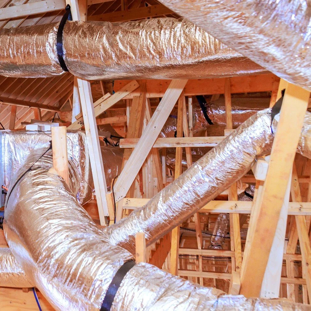 New air duct replacement and ductwork installed in a residential attic.
