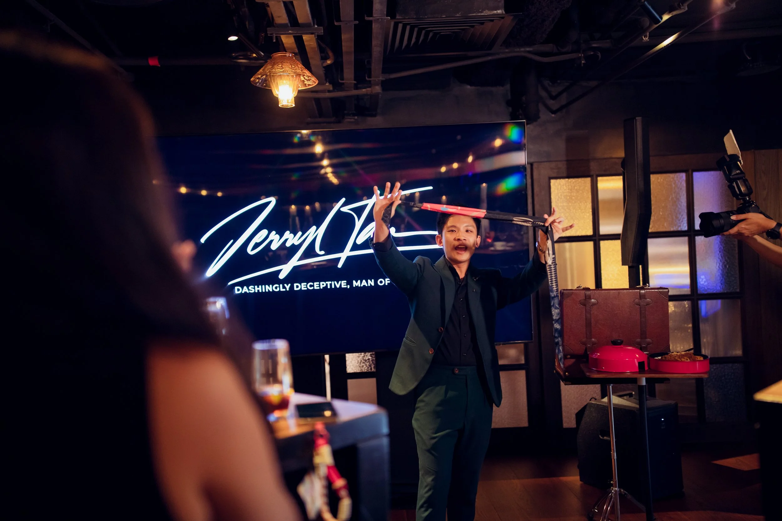 Magician Jerryl Tan at Grand Hyatt Singapore product launch and client appreciation event performing a customised magic trick.