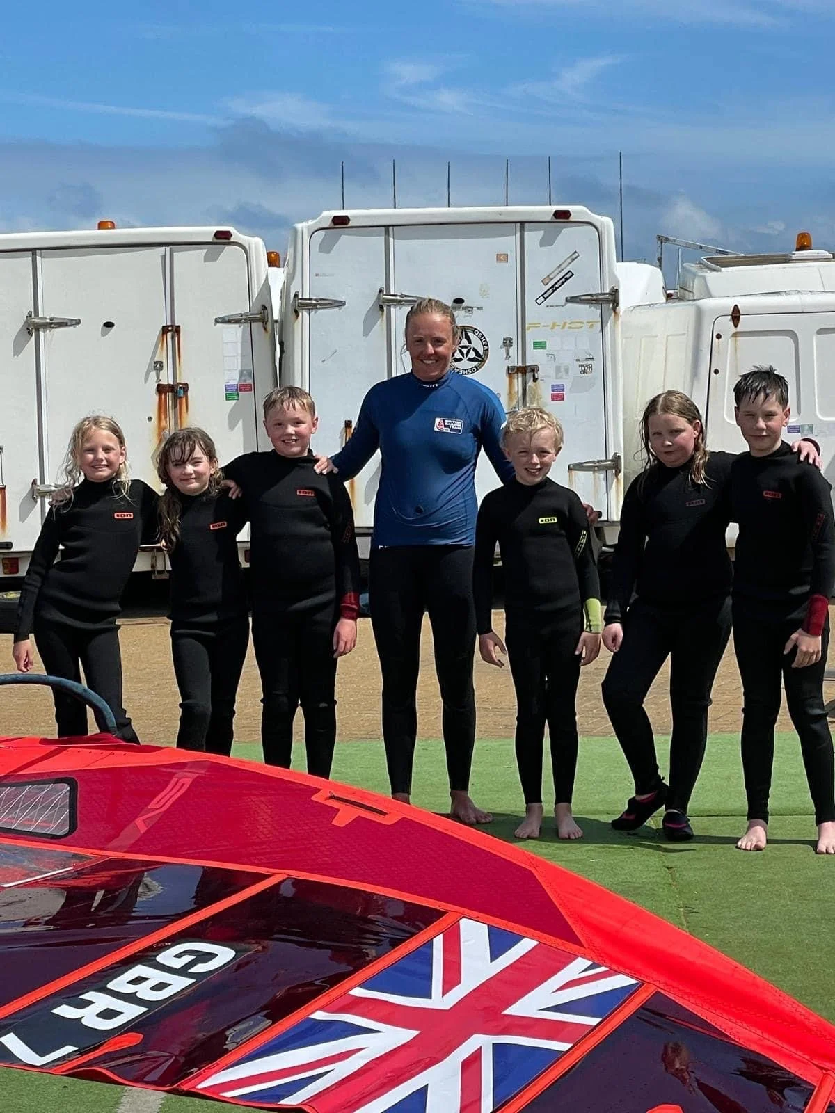 Emma teaching children windsurfing