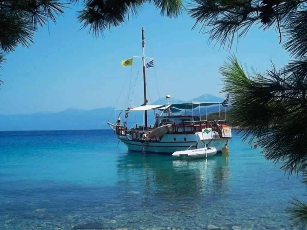 Our sailboat anchored in clear blue water