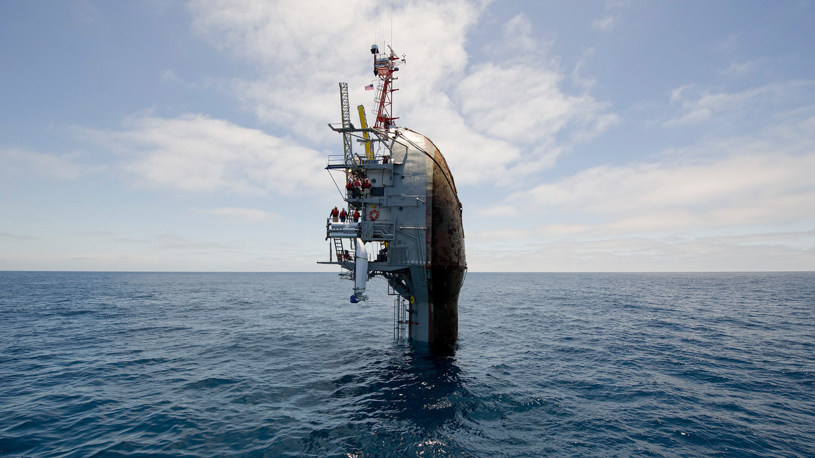 Marine research platform partially submerged in the ocean.