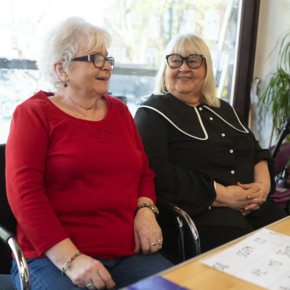 Two mature women smiling together