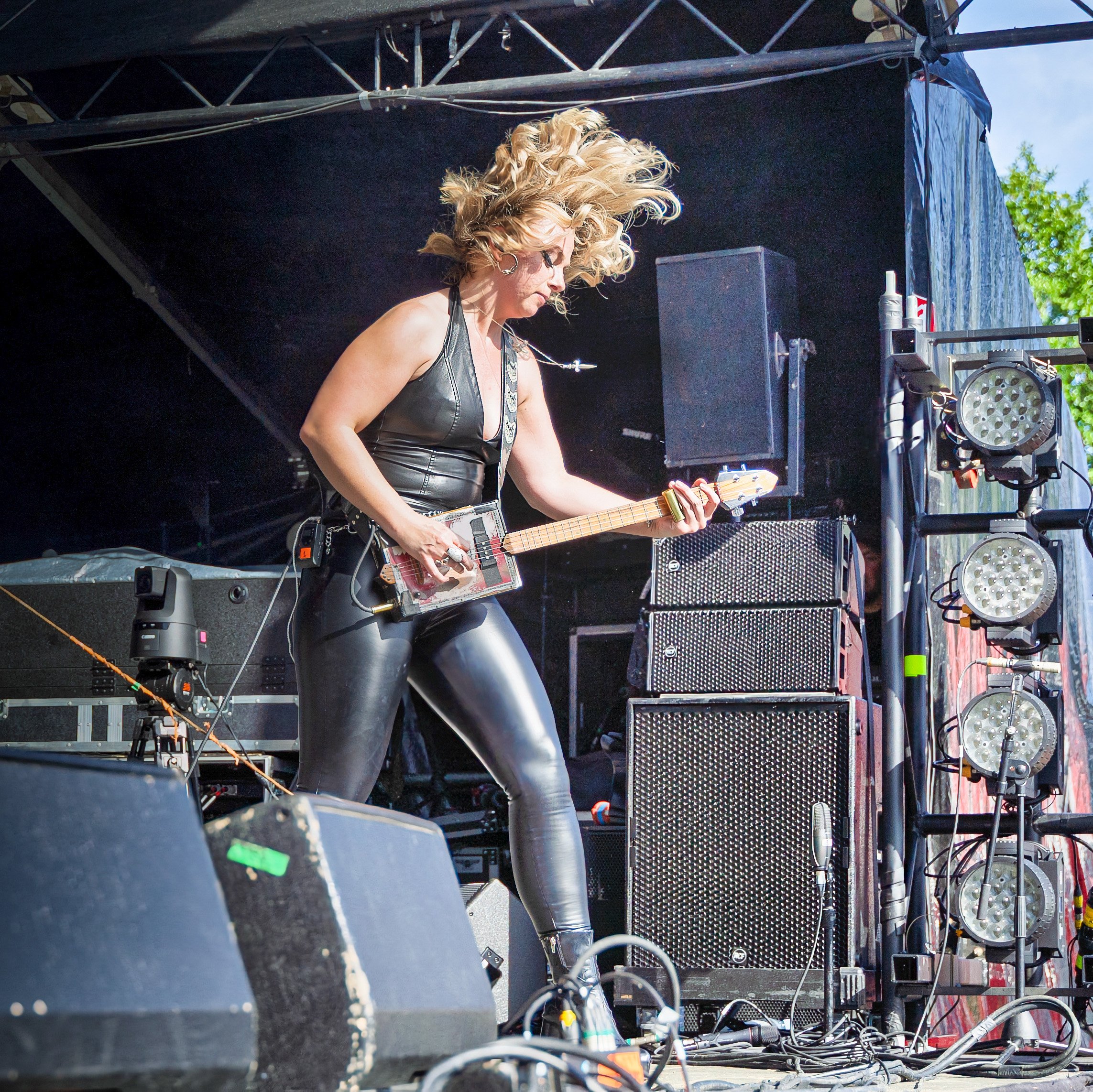 Samantha Fish performing with her cicar box guitar during an outdoor concert at Puistoblues Festival, Järvenpää, Finland, 2026.