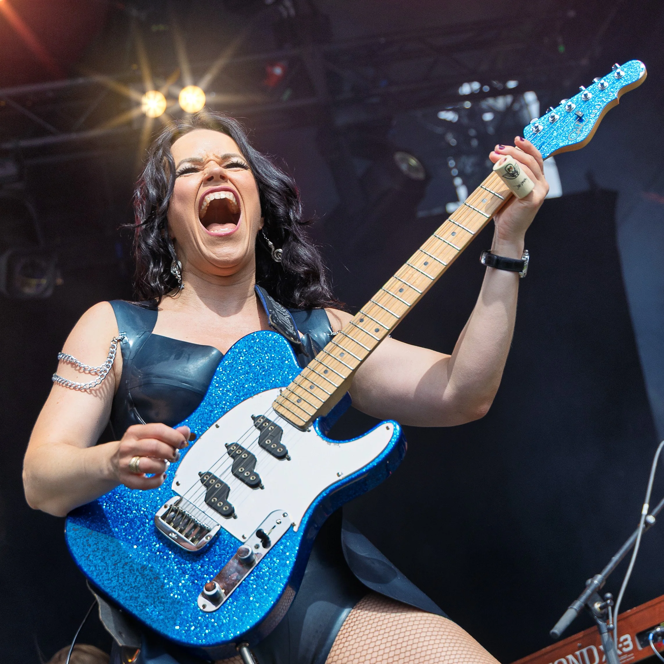 Erja Lyytinen captured during an expressive guitar performance at Puistoblues Festival 2026