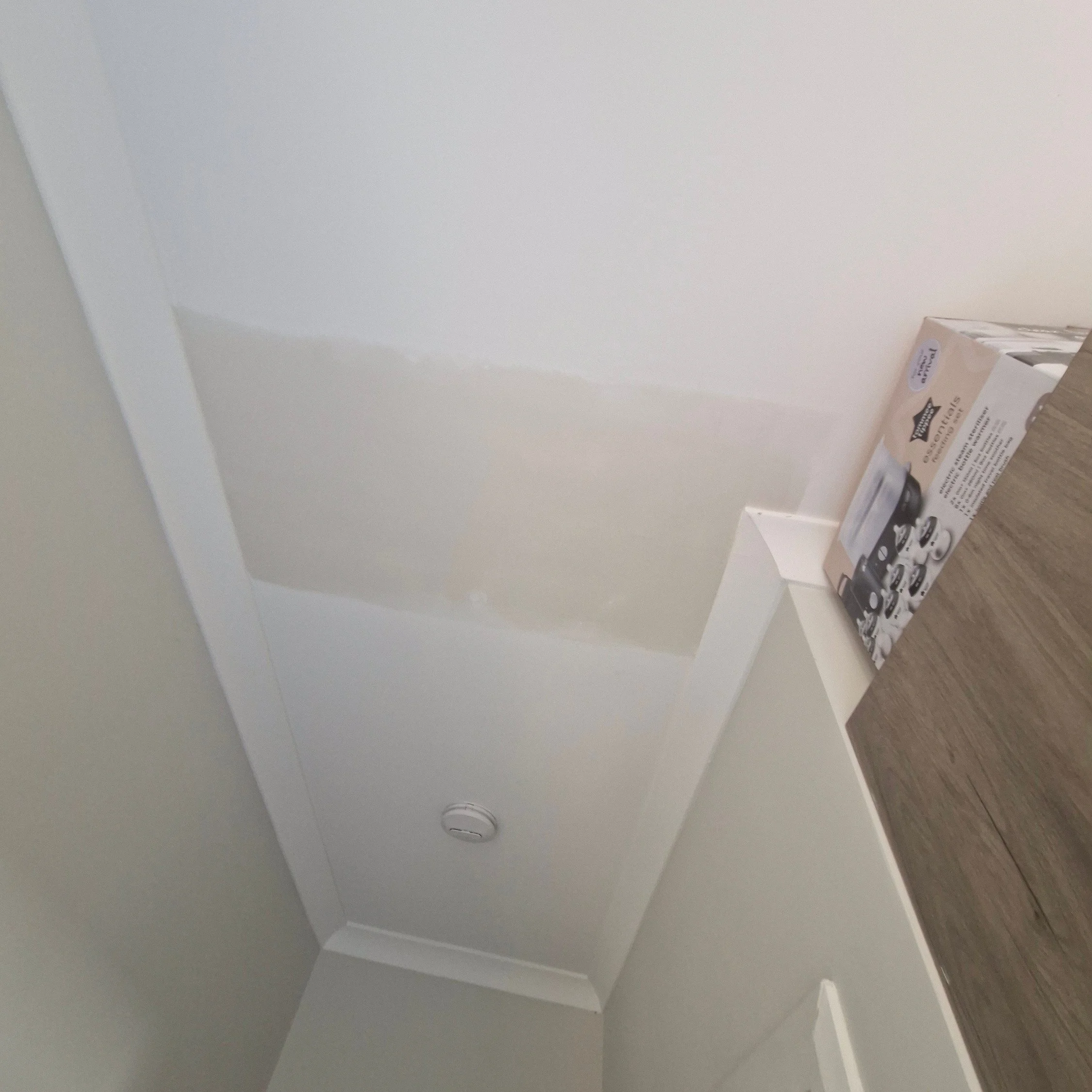 a ceiling patch that is complete in a residential home ready for painting