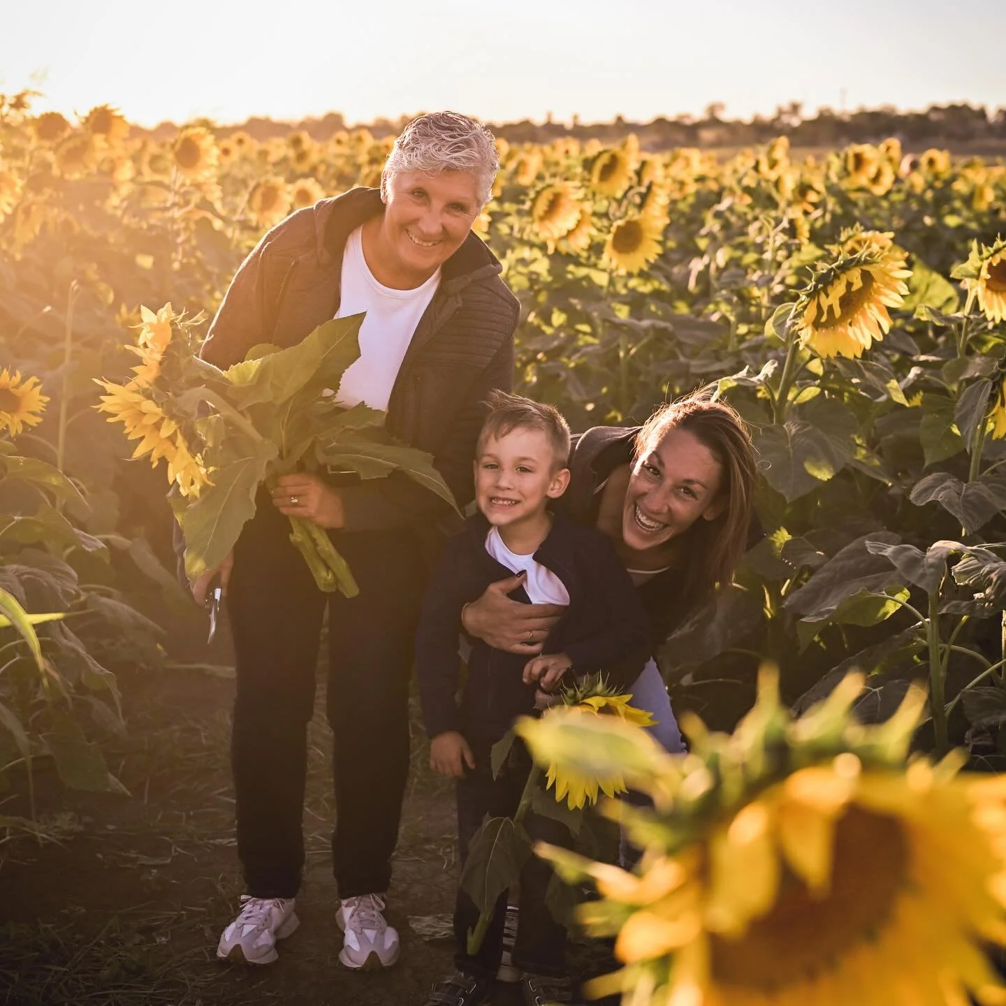 Isn&rsquo;t it fun gallivanting about a sunflower forest?! It sure was for this young boy and his mother and grandmother. What a lovely set of family photos to look back on for years to come. 
.
.
@hunter_valley_sunflowers is open to visit in the cur
