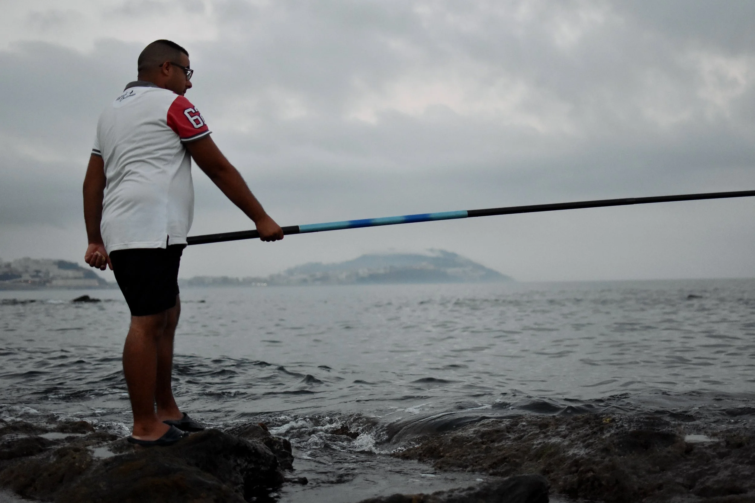A man fishes in the Moroccan town of Fnideq, on the border with the Spanish exclave of Ceuta. Euronews, Sept 2018. 