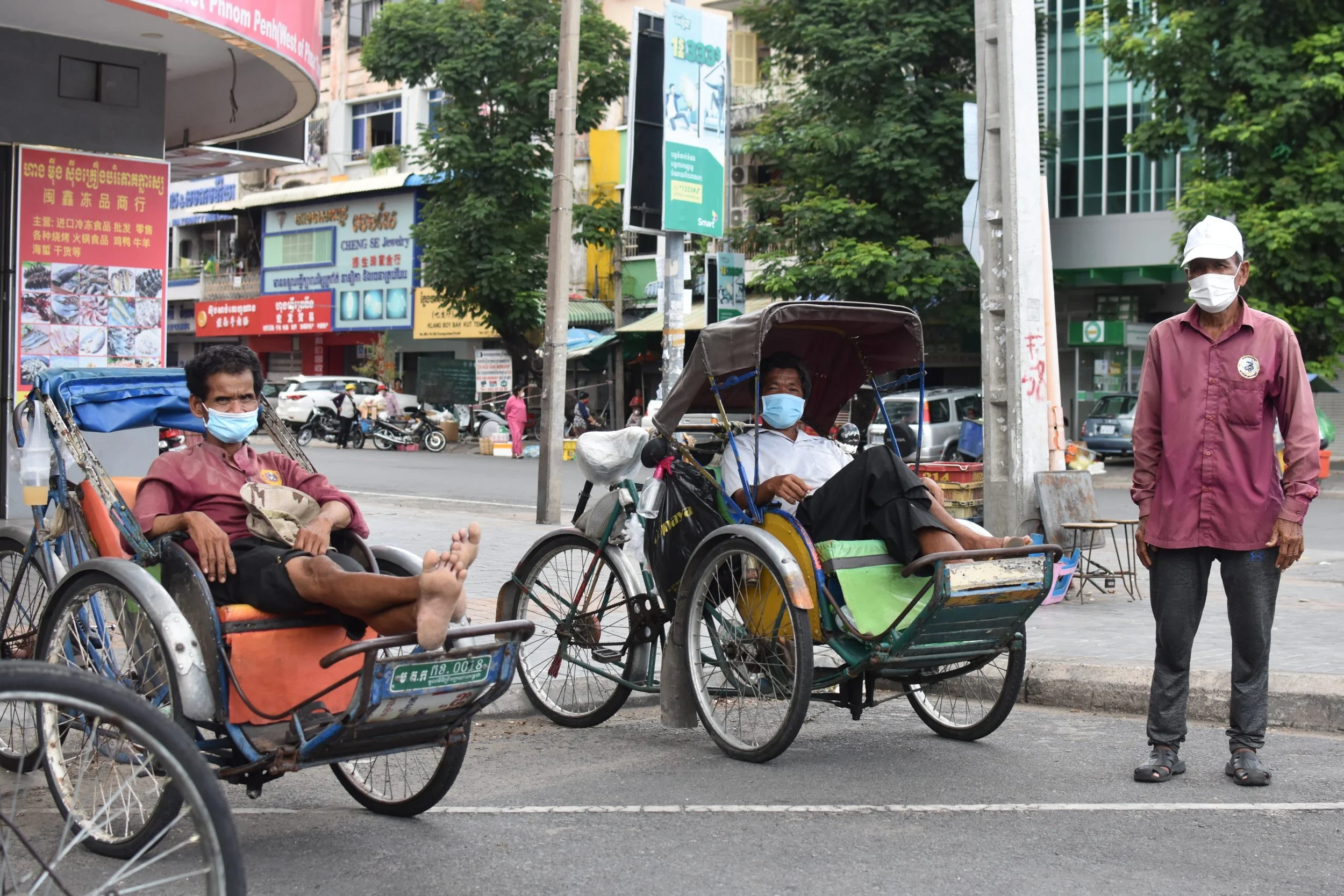 Pedlo drivers in Phnom Penh, Cambodia, during a COVID-19 lockdown. Southeast Asia Globe, April 2021.
