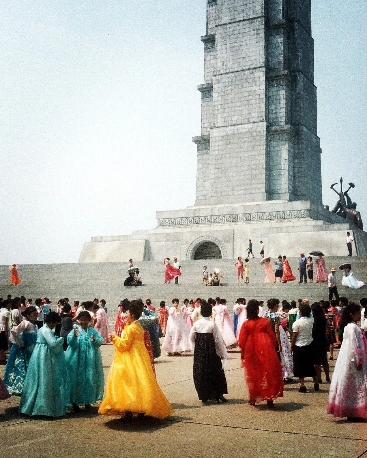 North Koreans prepare for Liberation Day at the Juche Monument in Pyongyang. The World Weekly, Aug 2015. 