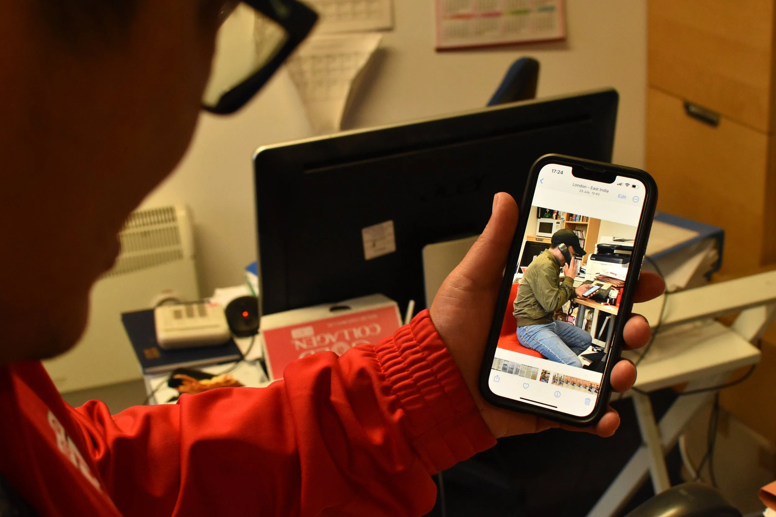 A Vietnamese community leader in London, England, shows the photo of a man he saved from a human trafficking ring. Radio Free Asia, Sept 2024. 