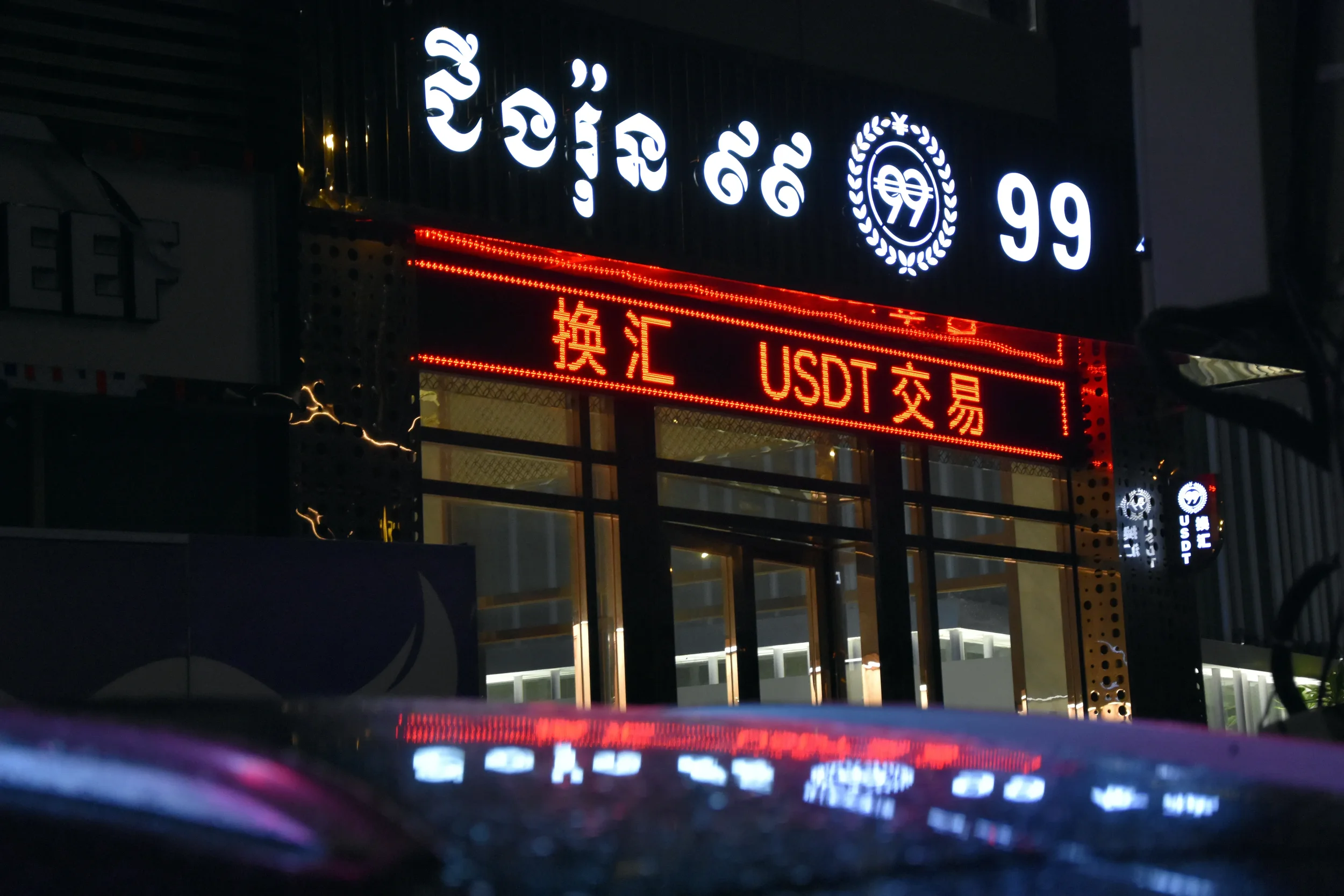 A shop sign advertising stablecoin USDT in Phnom Penh, Cambodia. VICE World News, July 2022. 