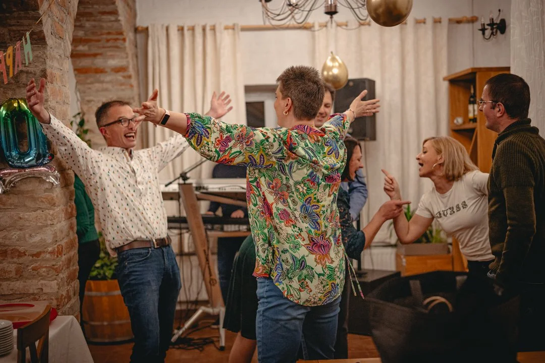 Guests dancing and celebrating at a birthday party in Orahovica, Croatia