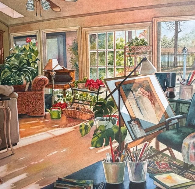Sunlit artist's studio with paintings, drawing supplies, and potted plants inside a room with large windows showing a garden outside.