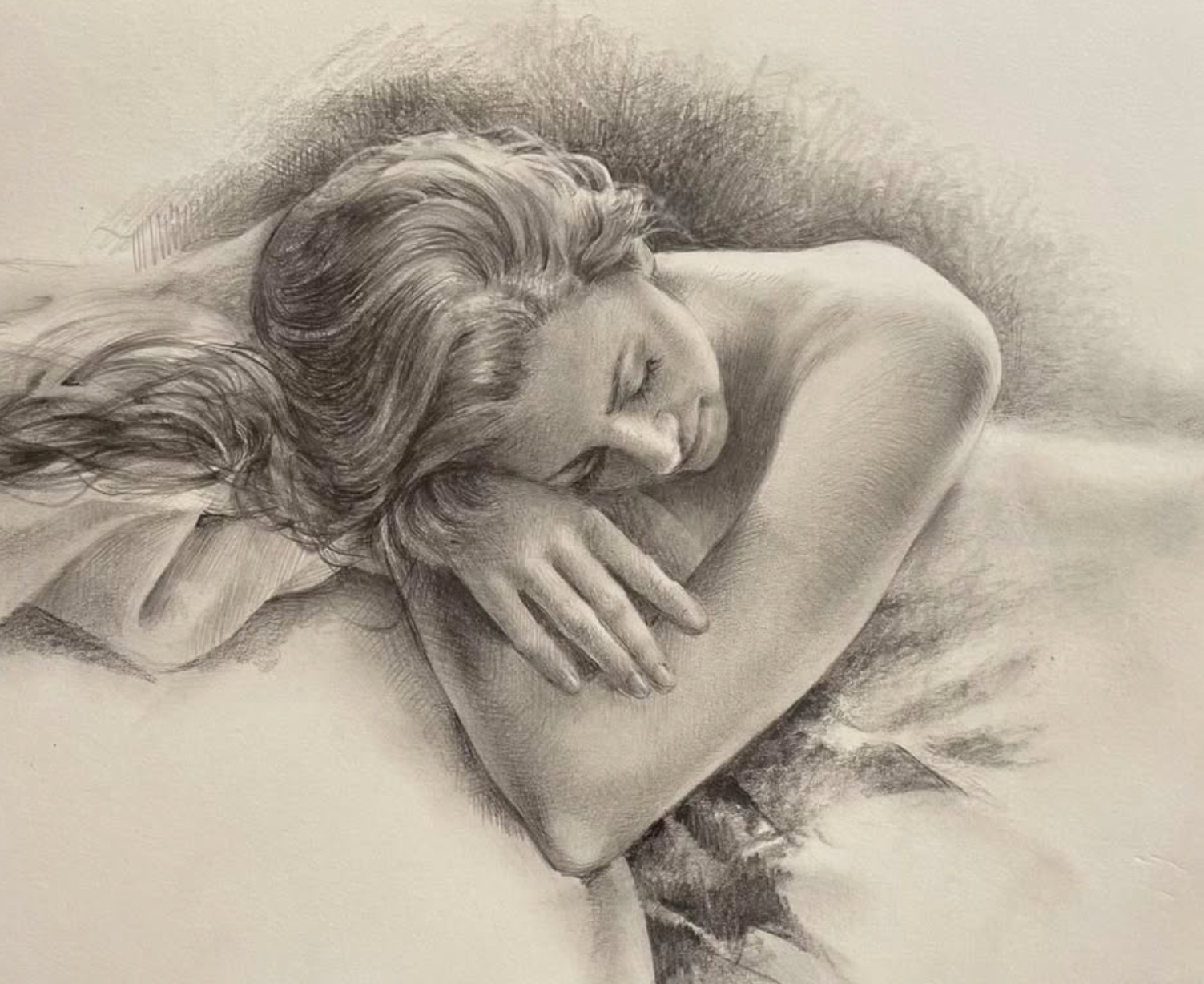 A realistic pencil drawing of a woman with long, wavy hair sleeping on her side, resting her head on her arm.