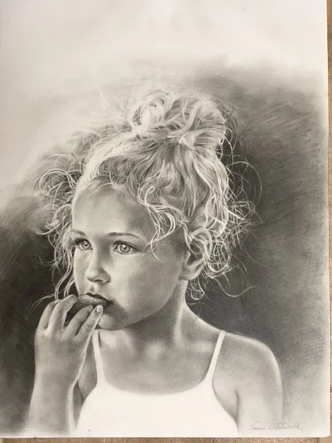 A detailed black and white pencil drawing of a young girl with curly hair in a top knot, wearing a spaghetti strap top, with her hand near her mouth and a thoughtful expression.