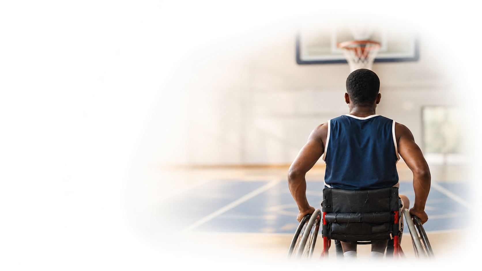 Wheelchair user taking part in basketball as part of goal-focused neurological rehabilitation