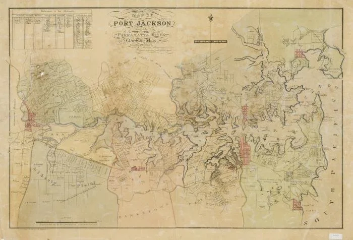 Historical map of Port Jackson, showing water bodies, land divisions, and some red-marked areas.