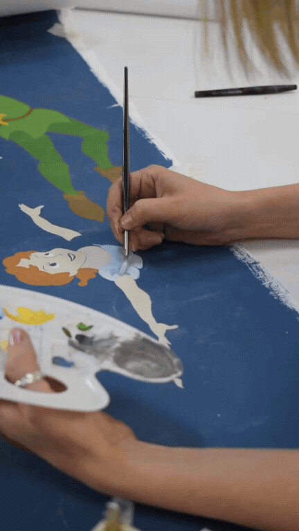 Social media reel of artist painting Disney Home wallpaper