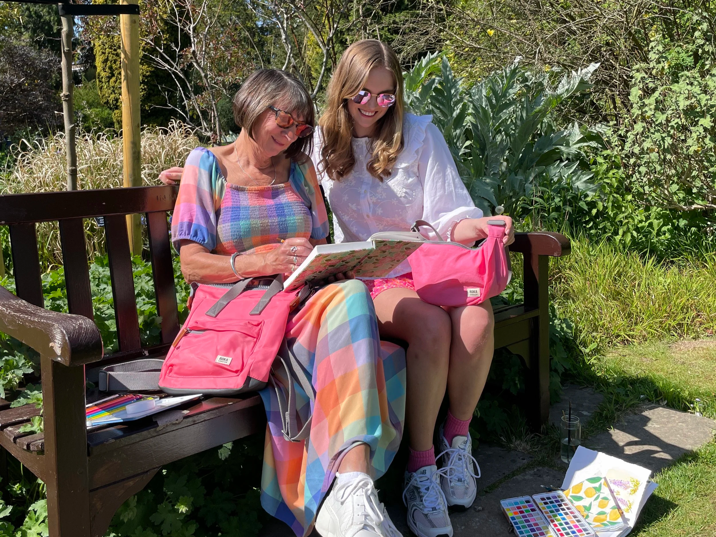 Social Media image of mum and daughter painting in a local garden