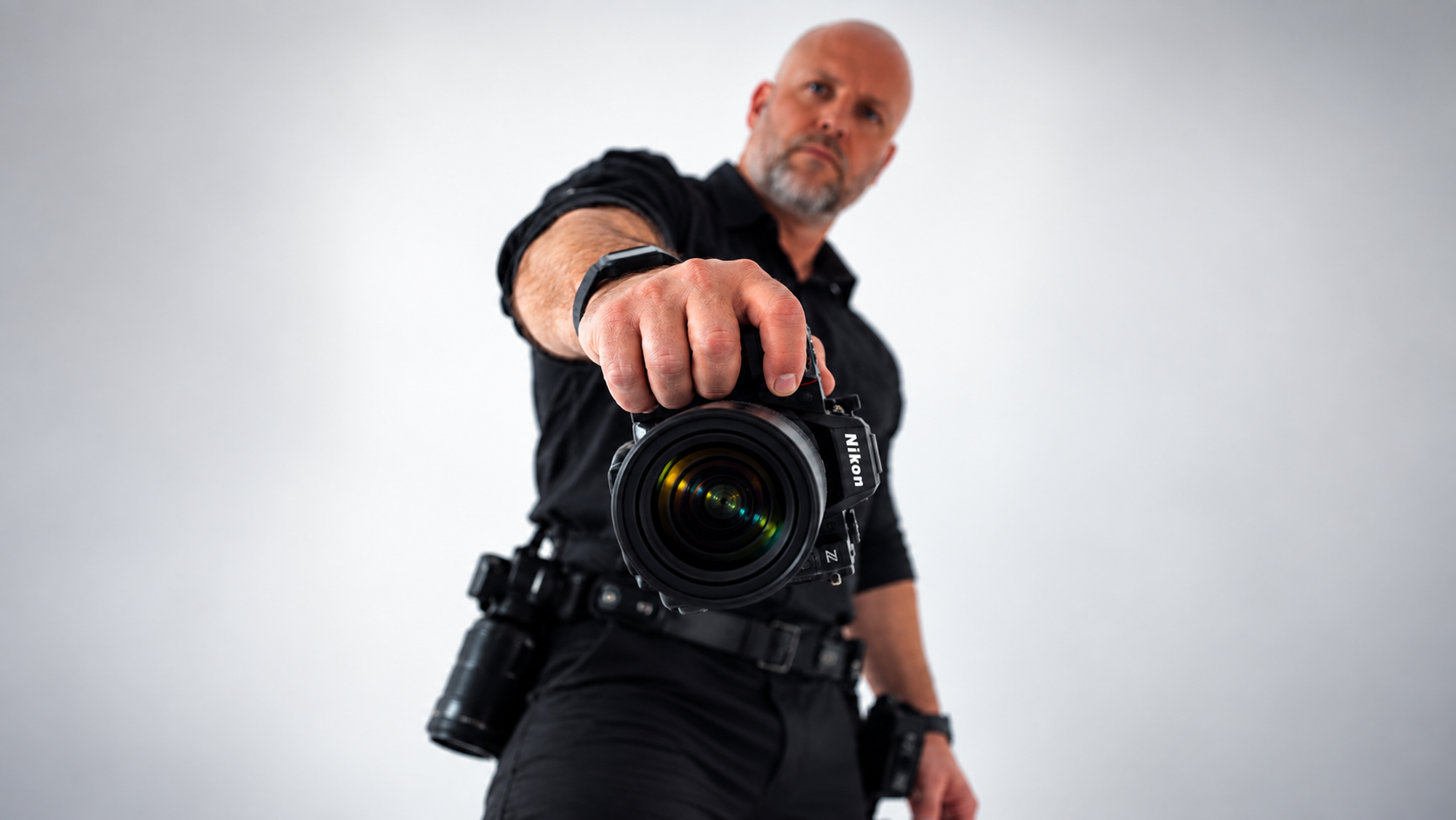 Scott Jelleyman of A&J Creative Photography holding a Nikon camera