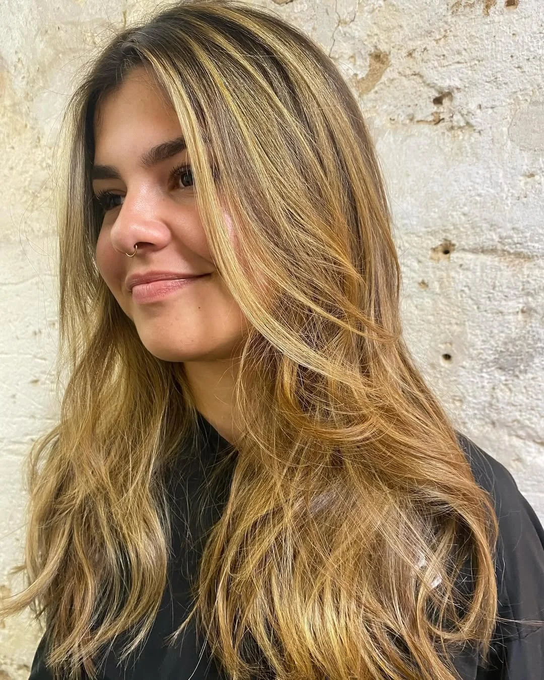 Honey-blonde balayage on long wavy hair, Mallorca