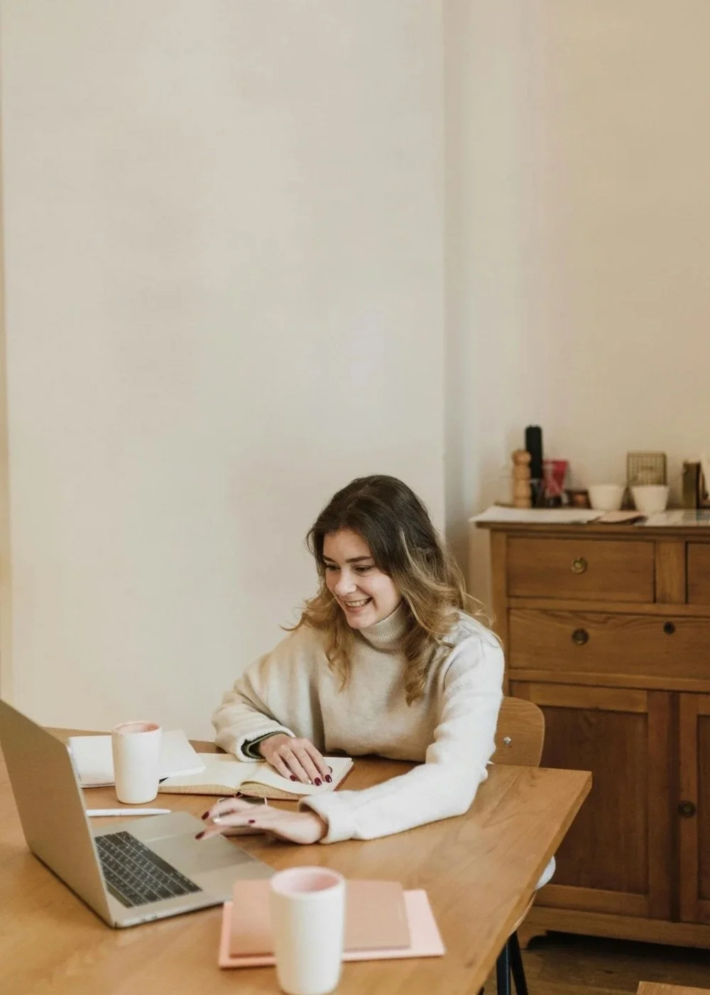 Adult woman participating in virtual therapy and reflection from home in a comfortable environment.