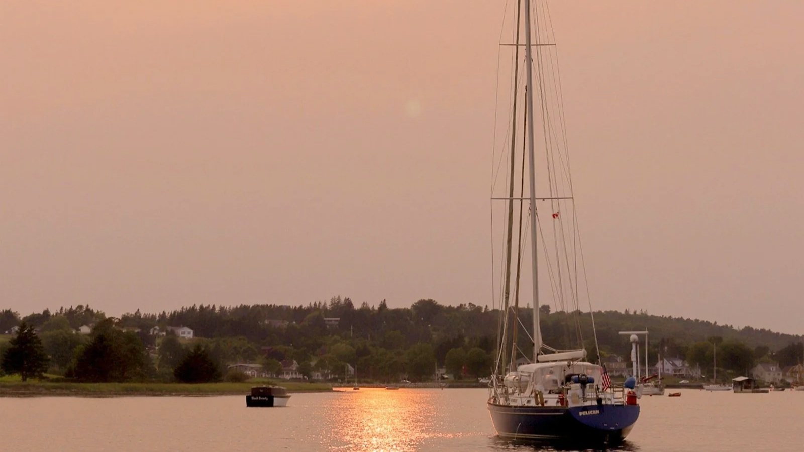 Sailboat at sunset off Lunenburg, Nova Scotia