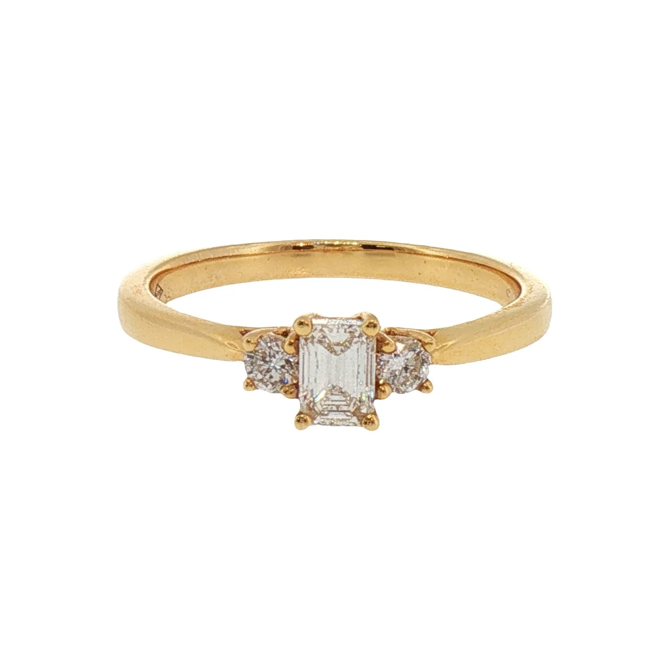 Emerald Cut and Round Brilliant Cut Diamond Three Stone Ring